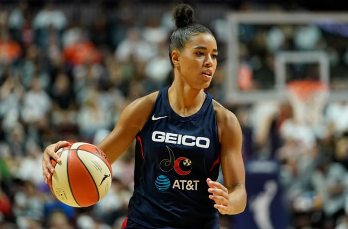 Natasha Cloud dribbles